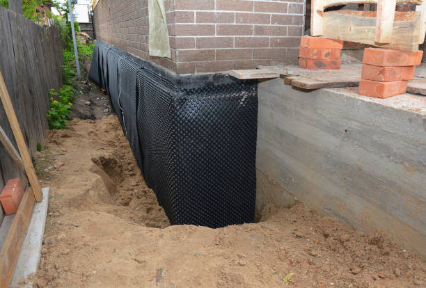 Happy homeowners after waterproofing job in Holbrook